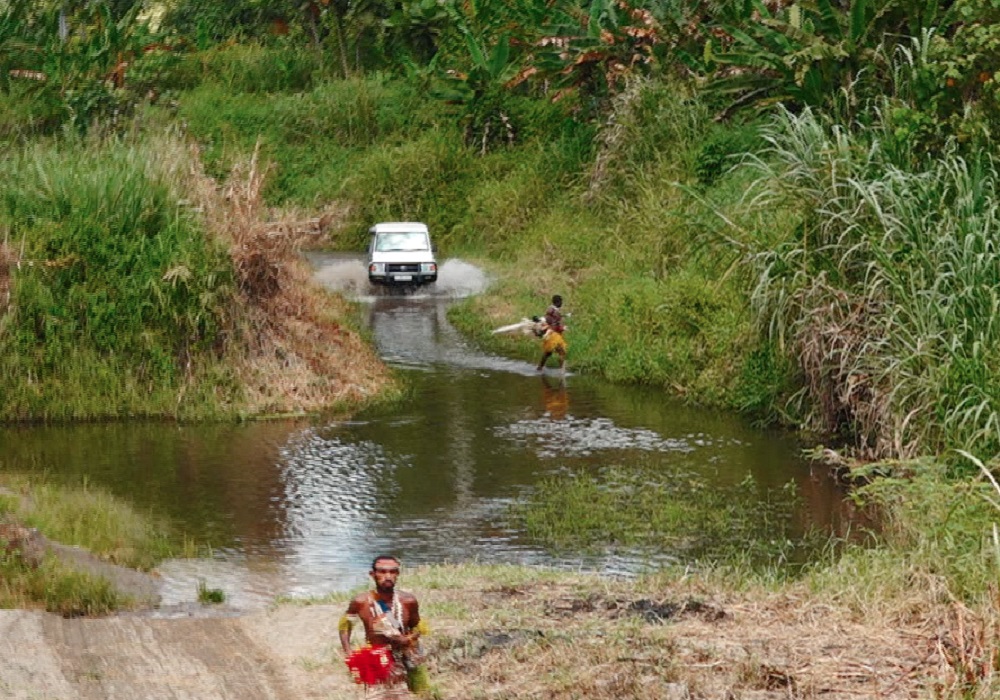 Crossing the creek to Horau Hururu Community