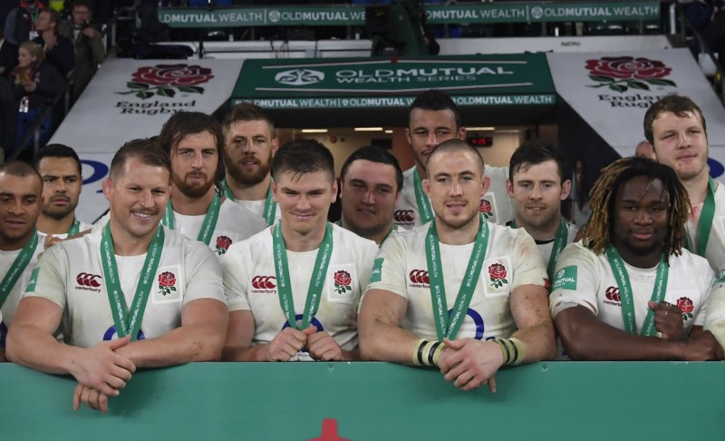 Britain Rugby Union - England v South Africa - 2016 Old Mutual Wealth Series - Twickenham Stadium, London, England - 12/11/16 England celebrate with their medals as they pose for a team group after the game Reuters / Toby Melville