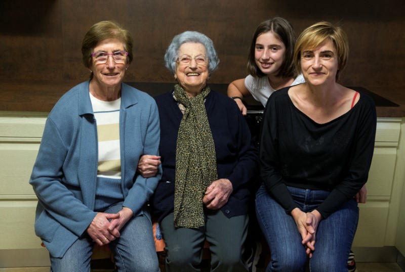 Pilar Fernandez (2nd L), 101, poses for a portrait in the kitchen of her home with her daughter Pili (L), granddaughter Flori (R) and her great granddaughter Ana in Ambas, Asturias, northern Spain, October 18, 2016. Fernandez suffered hunger and hardship during the war years alongside her nine brothers and sisters. To avoid history repeating itself, she limited herself to just one child. "From pure fear, I didn't have anymore," says the sprightly woman who lives with her daughter's family and tends livestock and a vegetable garden.ÊREUTERS/Andrea Comas