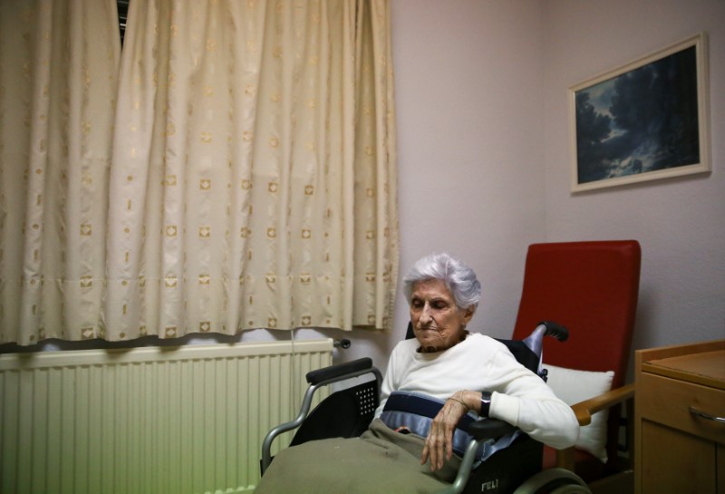 Edelmira Abascal, 102, poses for a portrait in her room of a residential home for the elderly in Torrelaguna, outside Madrid, Spain, November 22, 2016. " (The famous American author) Ernest Hemingway used to say Ôthere goes the brunetteÕ when he saw me pass by in the street," she said. Abascal worked as a secretary for a Republican general during the Civil War and once it became clear the Republicans were losing the city of Madrid to Francisco Franco, she was put in a convoy fleeing Madrid for Barcelona. In the convoy was a truck full of explosives that were used to blow up four buildings in central Barcelona, she recalls. REUTERS/Andrea Comas
