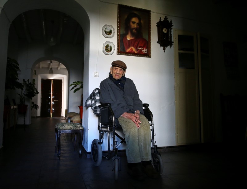 Francisco Nunez, 112, poses for a portrait at his home in Bienvenida, Badajoz, southern Spain, December 11, 2016. Nunez lives with his octogenarian daughter. He says he doesn't like the pensioners' daycare centre because it's full of old people. REUTERS/Andrea Comas