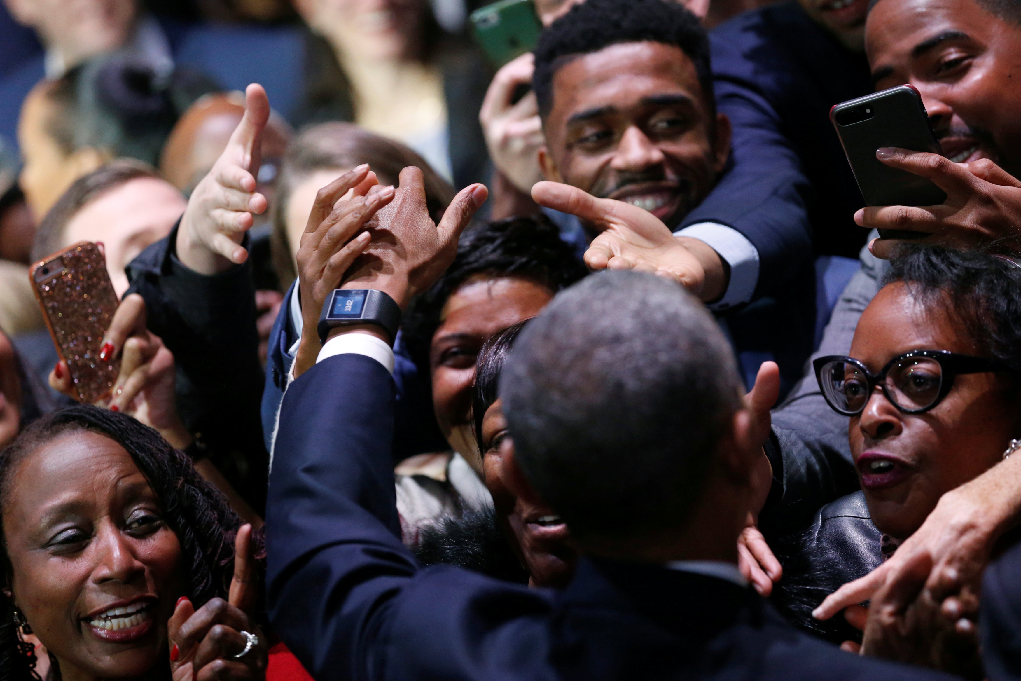 U.S. President Barack Obama greets people in the audience after his farewell address in Chicago, Illinois, U.S. January 10, 2017. REUTERS/Jonathan Ernst