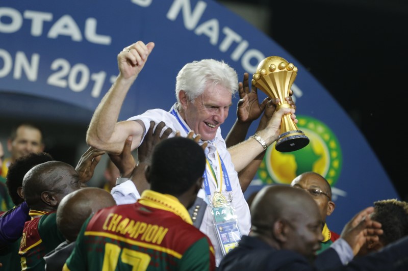 Football Soccer - African Cup of Nations - Final - Egypt v Cameroon - Stade d'AngondjÃ© - Libreville, Gabon - 5/2/17 Cameroon coach Hugo Broos celebrates with the trophy and teammates after winning the African Cup of Nations Reuters / Amr Abdallah Dalsh Livepic