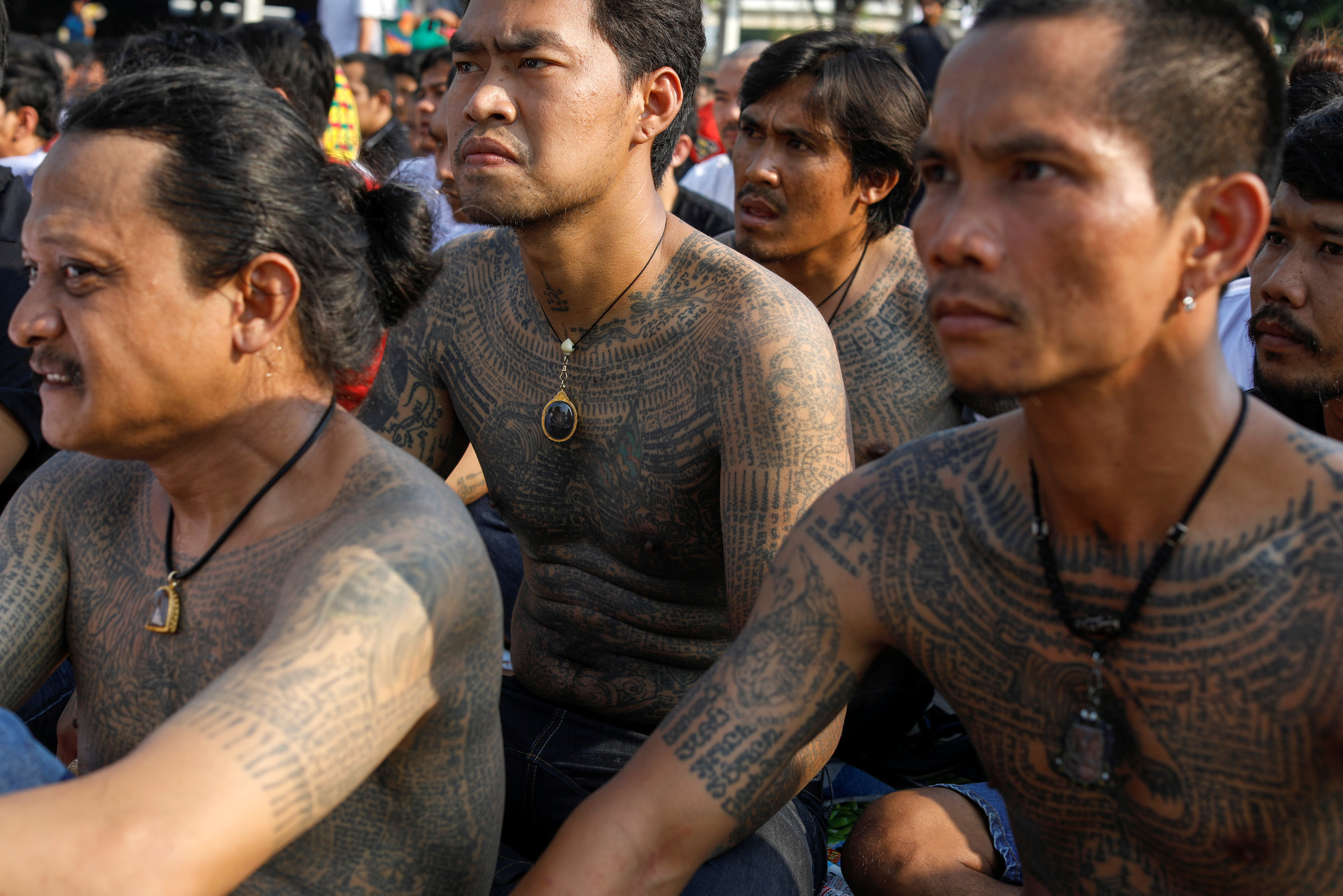 Devotees attend the religious tattoo festival at Wat Bang Phra, where they come to recharge the power of their sacred tattoos, in Nakhon Pathom province, Thailand, March 11, 2017. REUTERS/Jorge Silva