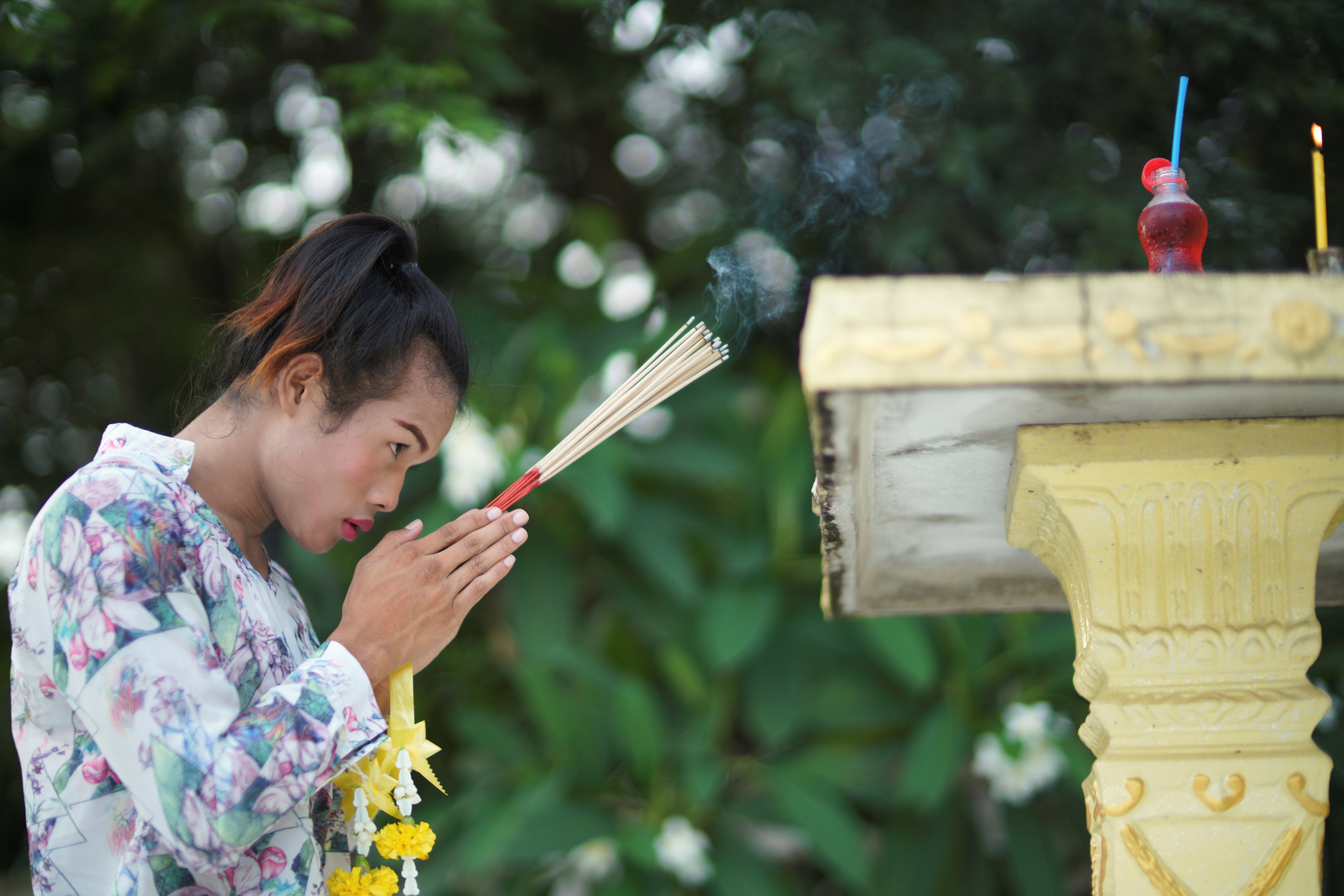 Muay Thai boxer Nong Rose Baan Charoensuk, 21, who is transgender, prays at a shrine near the Baan Charoensuk gym in Chachoengsao province, Thailand, July 12, 2017. REUTERS/Athit Perawongmetha