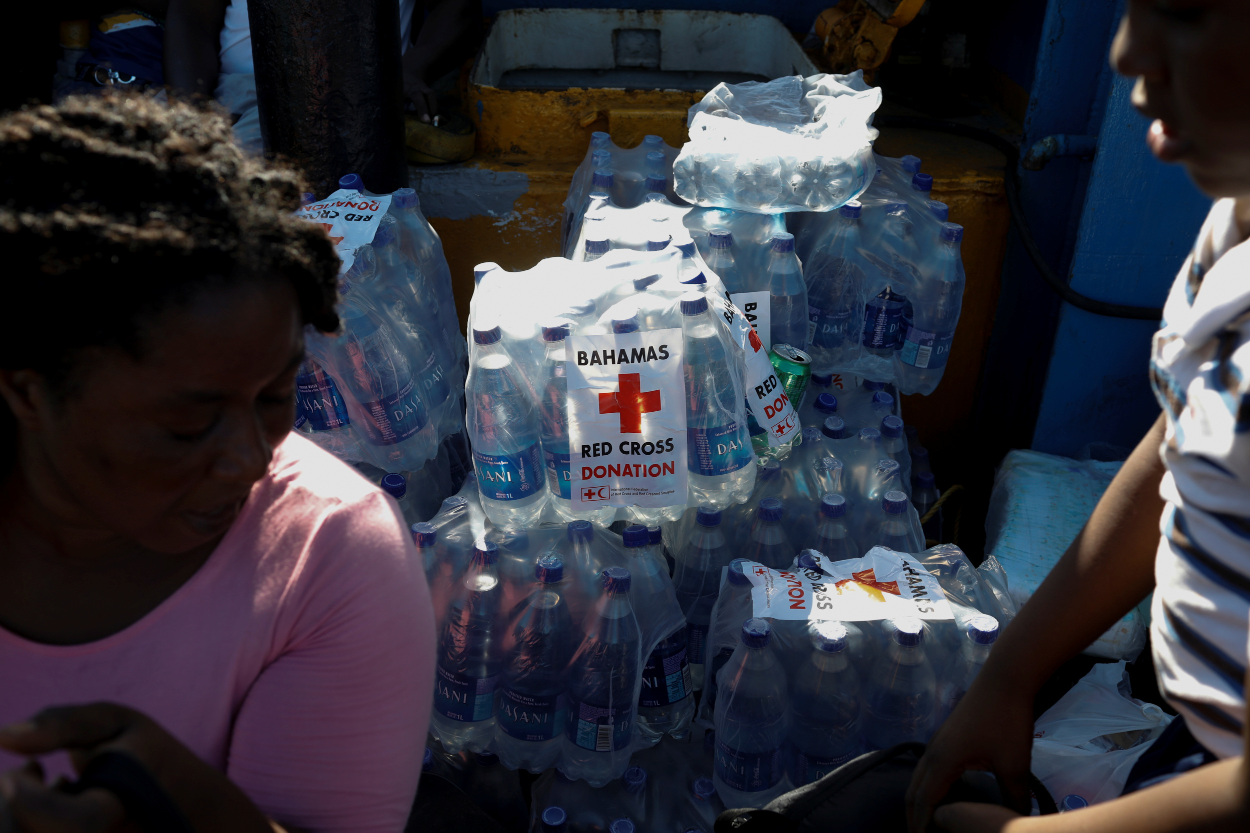 Bottles of water with the logo of Red Cross are seen in a ferry at Marsh Harbour Government Port during an evacuation operation after Hurricane Dorian hit the Abaco Islands in Marsh Harbour, Bahamas, September 6, 2019. REUTERS/Marco Bello