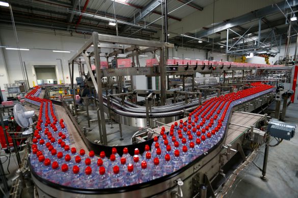 FILE PHOTO: Bottles of Evian water, part of Danone group, are pictured in the new bottling plant during the official opening ceremony in Publier near Evian-les-Bains, France September 12, 2017. REUTERS/Denis Balibouse/File Photo